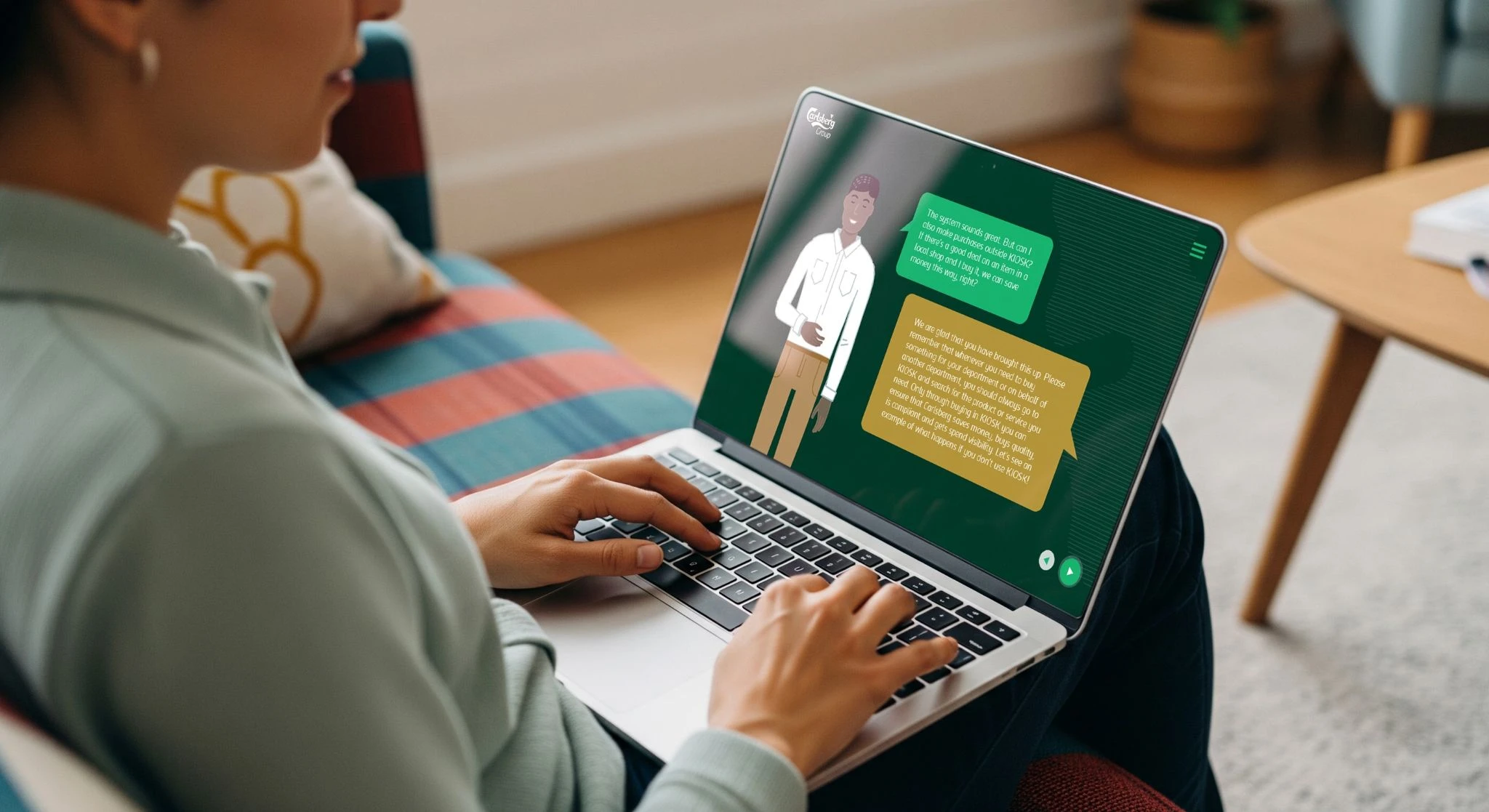 Person using a laptop displaying an interactive Carlsberg training conversation.