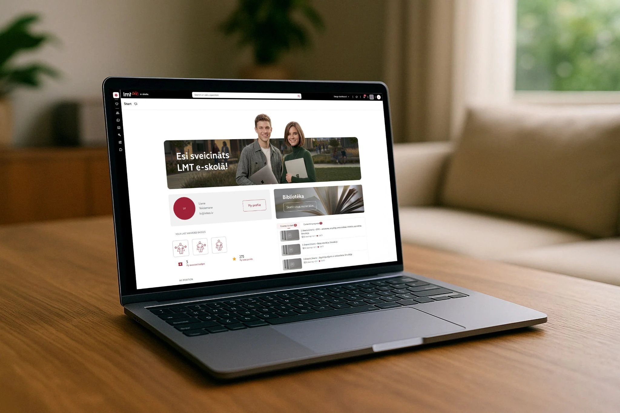 Laptop displaying the LMT e-skola learning platform homepage.