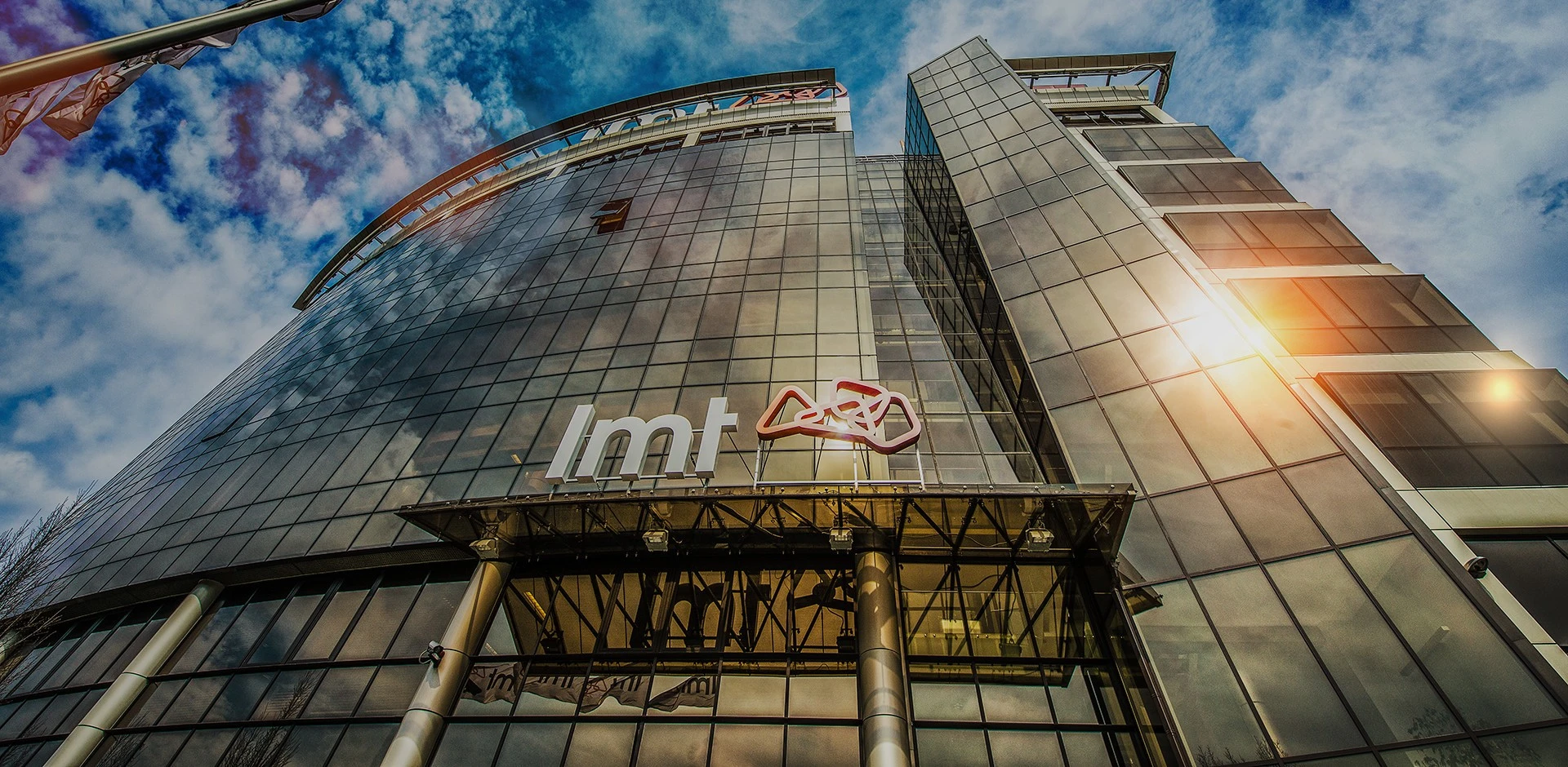 LMT: Low-angle view of the LMT office building with the company logo.