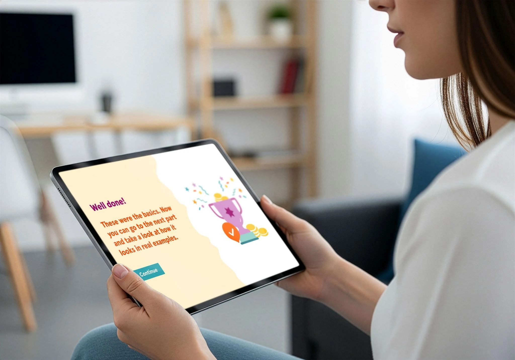 Woman holding a tablet displaying a completed financial learning lesson with a trophy illustration.