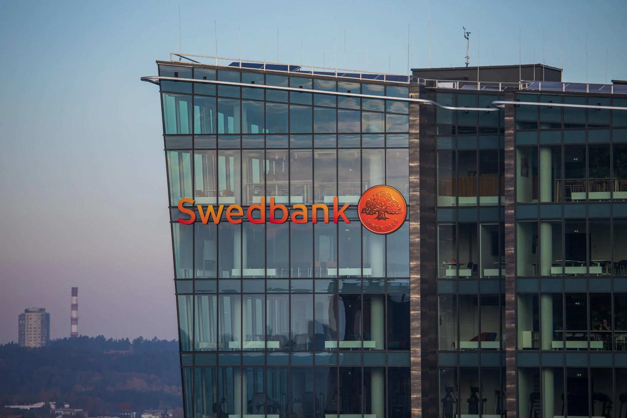 Swedbank: Swedbank headquarters building with the orange Swedbank logo.