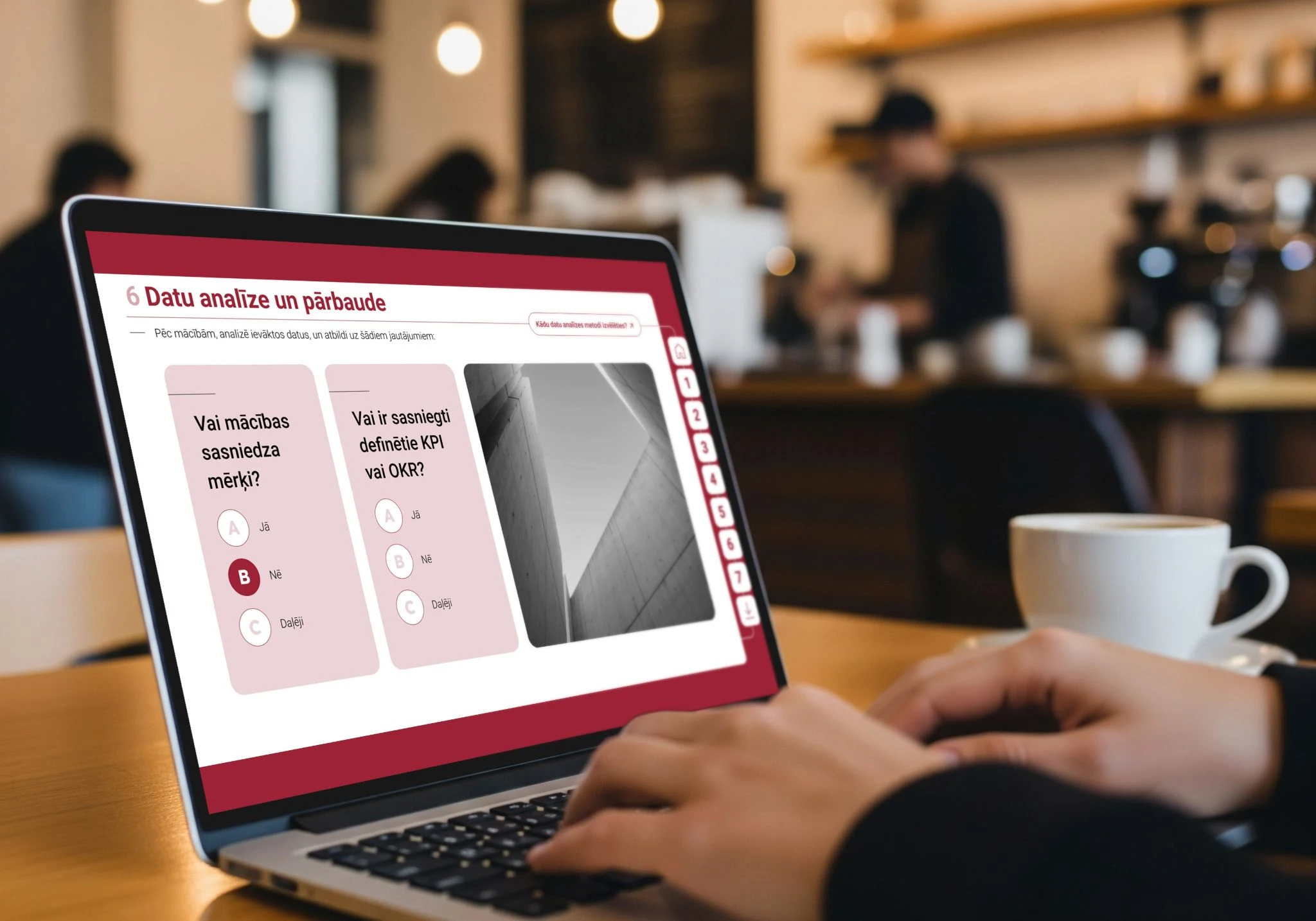 Person completing a data analysis and evaluation quiz on a laptop in a café.