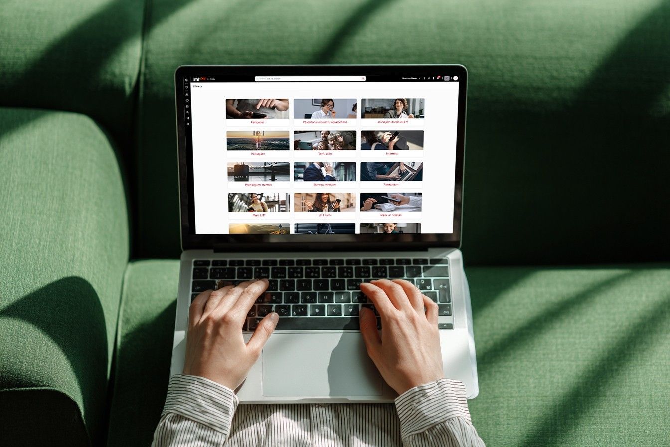 Person browsing a grid of online training courses on a laptop.